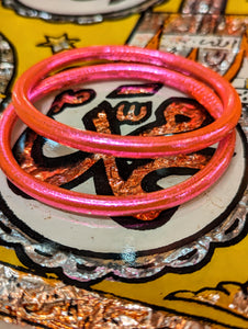 Wow, just look at the colours!!!Wonderful every day wear, waterproof, weightless bangles.

Crafted in Thailand , these are made from tubing lined by hand with real coloured gold leaf, the same as is used on Buddha statues.  Wear them swimming, working, playing and  you never lose the glam, disco dolly shine!

Made of medical grade tubing and coloured gold leaf..

Size nside diameter 6cm


