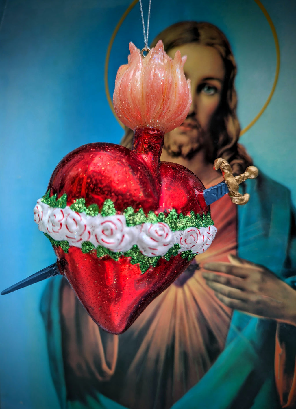 Big and beautiful flaming Sacred heart of the Virgin with roses and a sword!! a gorgeous addition to your Christmas tree or festive holiday display, but also the BEST wedding gift!

Hand finished glass decoration 

Size 12 x 5 x 3.5cm

Fragile, handle with care

Cody foster and co sacred heart