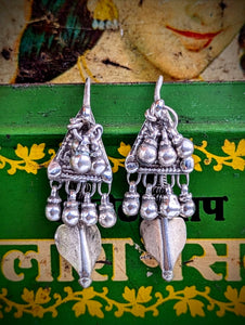 Lovely worn rare Rajasthani  antique silver earrings, these are a traditional Banjara design.

These move beautifully as all the bells are individually hung. These are completely original, and so have slightly thicker ear wires than the usual ones.

Approx 4cm length.

Antique silver, there is no hallmark as these are old country pieces, but are a high grade silver.