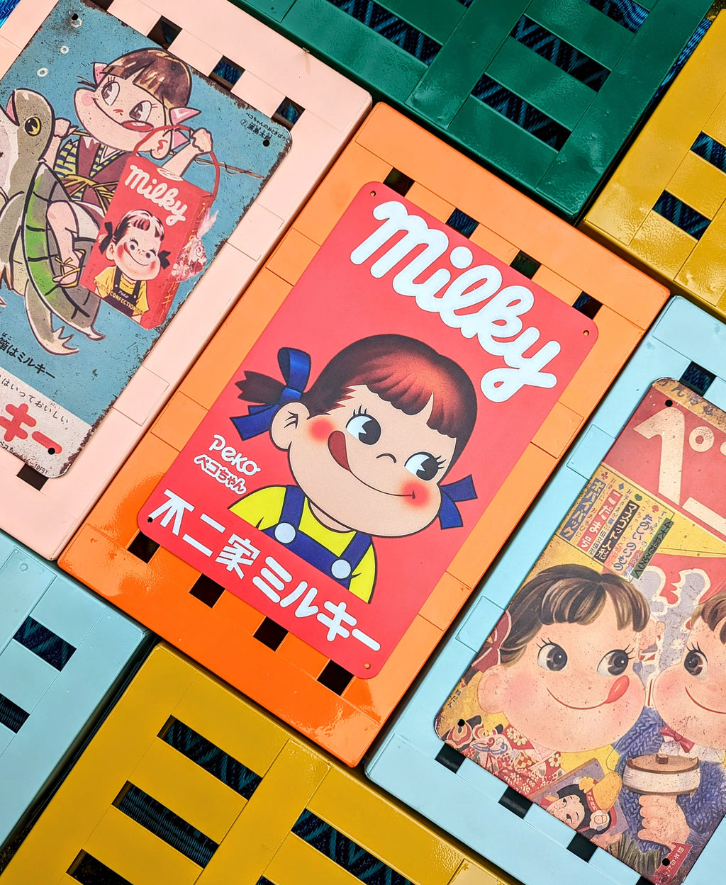 Japan's best vintage Peko Milky sweets advertising graphics printed on a tin sign!, what fantastic cheeky faces those kids have got!!

Great up on the wall or even tile behind a sink or cooker with them for a bit of eye joy!!

20x30cm

Printed tin

Not original vintage.