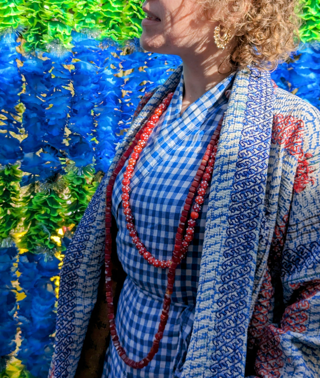 Super soft vintage kantha jacket, made from beautifully aged quilts, which are then block printed over with indigo blue prints. Hand stitched layers of fabric, all old and all washed again and again.making these super cosy and soft to wear.

These are one size, fit everyone from a UK 10-18 size , all styles are slightly different, refer to pics, all....all have pockets!!

Wash by hand or in the machine at 30 degrees

Due to their vintage nature there may be small marks or loose stitches on the embroidery 