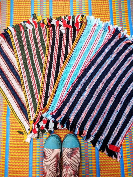 Made from surplus fabrics produced from the sports garment industry in Thailand, used as bathroom and doorway mats, and handily machine washable!
Due to their reuse and recycle nature, the colours and sizes vary a little. 
Approx 60 x 38cm