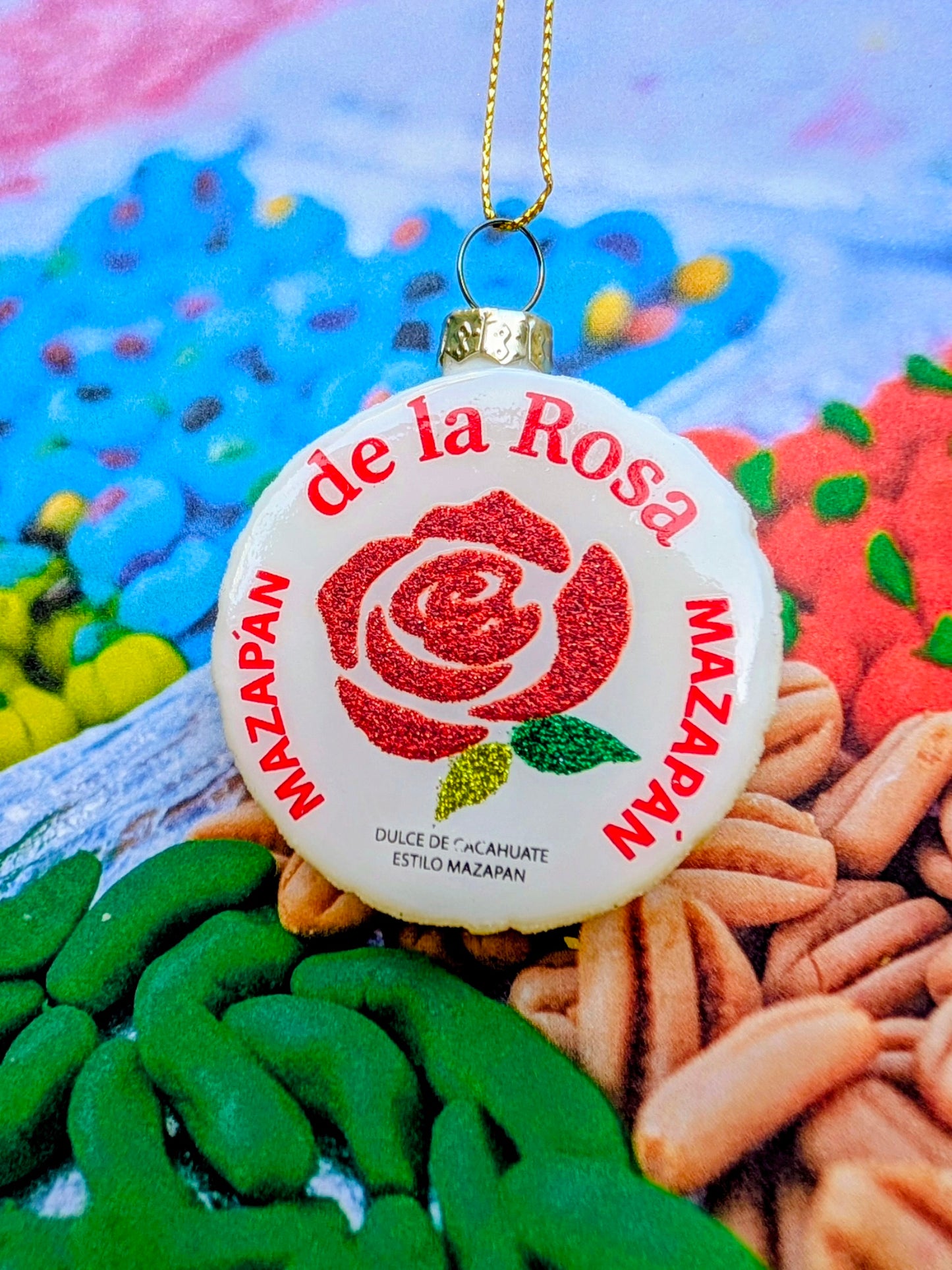 Decorative ornament with 'de la Rosa' and 'Mazapan' branding on a colorful background.