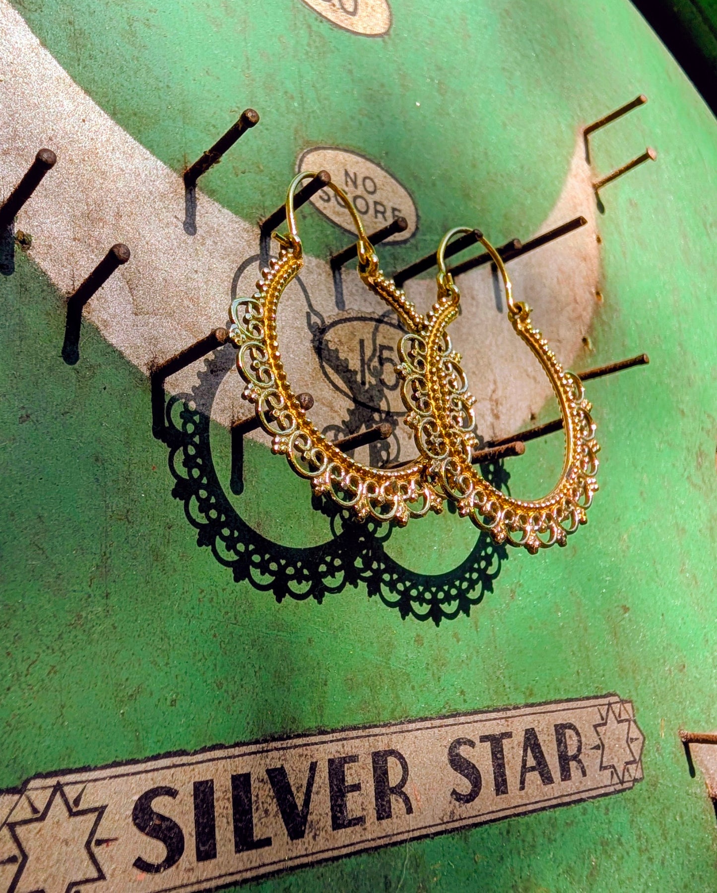 Fancy brassy Indian hoops