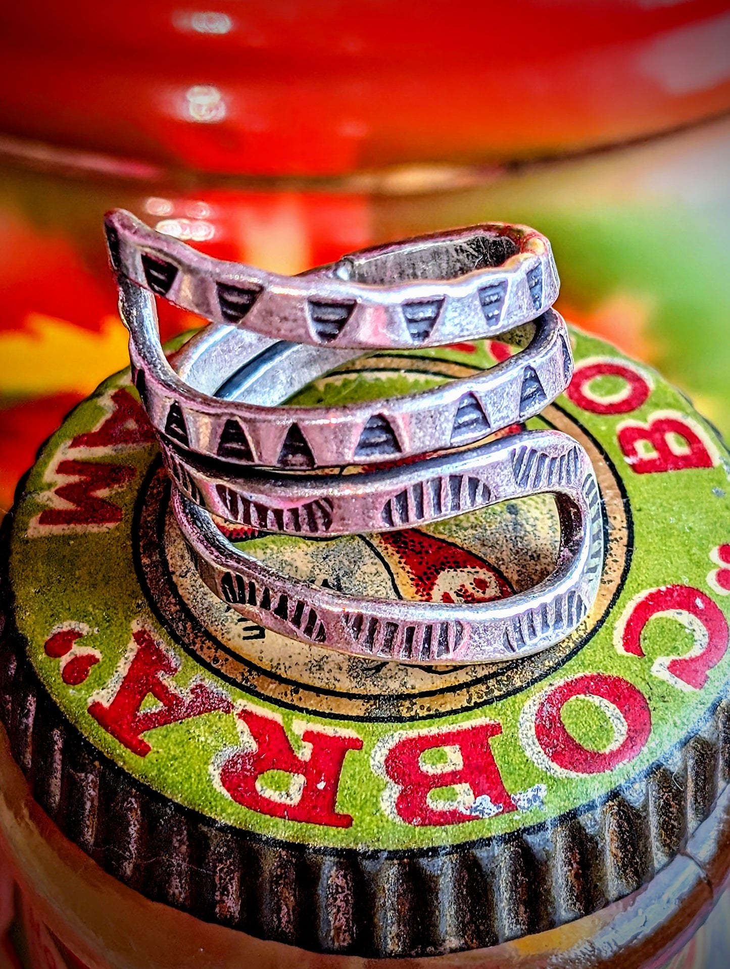 Snakey, sculptural, stamped rings. Available in sizes, but these are such soft silver they can be stretched or coiled in to fit. All pieces are hand made and hand finished using traditional methods.
Hill tribe silver has a higher content of silver, at 99.5-99.9% compared with sterling silver at 92.5%. This allows the silver to wear and soften differently from standard sterling silver. All pieces are hand made and hand finished using traditional methods. The texture in these pieces show the malleable nature