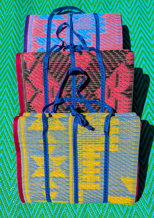 Woven plastic picnic mats, perfectly compact and easy to carry, complete with handle! Easy to wash down too!
A totally practical surface for camping, parks, beach, picnic and around the size of a single bed, small enough to store in the back of the car or under the stairs!
Measures approximately  95cm x 190cm unfolded and 34 x 25cm folded for carrying.