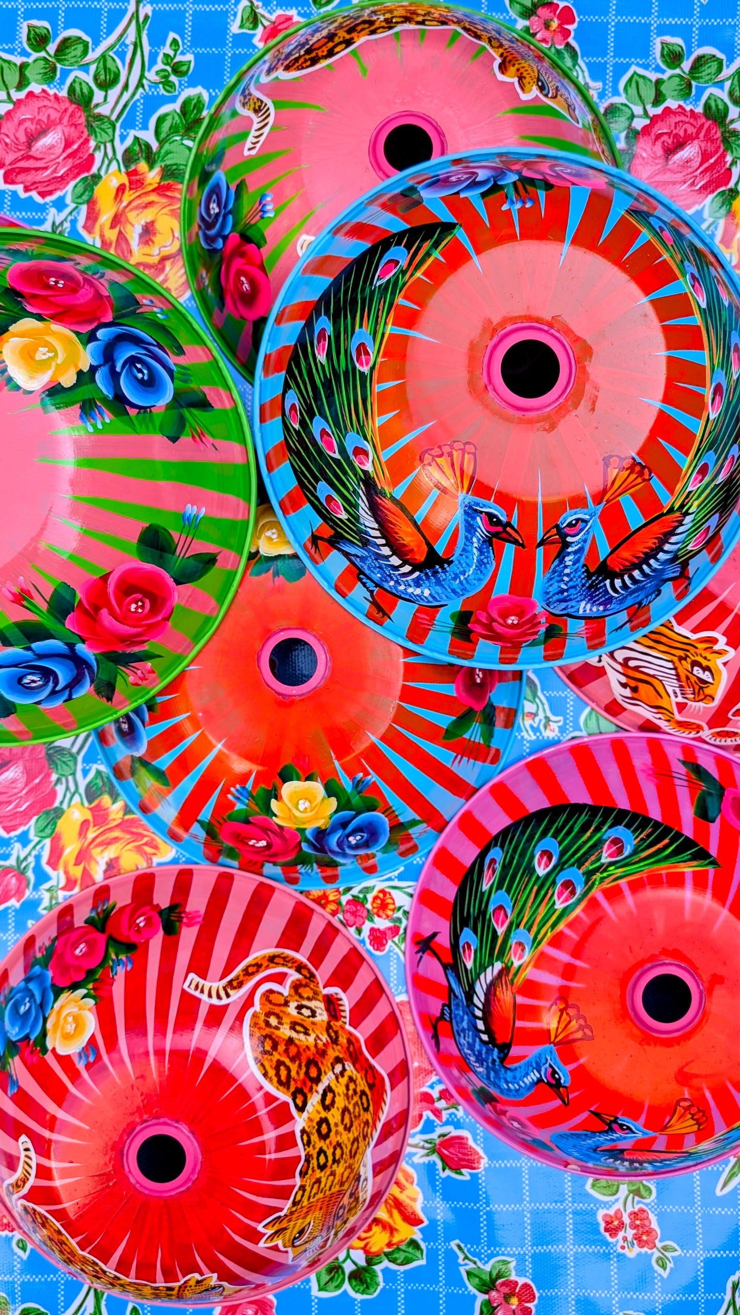 Oooooh....how delicious are these?!?!?
Handpainted in Pakistan by the artisans that paint the fabulously flamboyant trucks!
These lampshades are painted with heavy duty enamel paints onto spun recycled aluminium. Suitable for light cool water washing only. Due to their handmade production these may vary a little and also have painting and enamel imperfections.
Will fit onto standard UK ceiling/lamp fitting.
Dimensions 30 x 30 x 10cm
30mm diameter hole.
