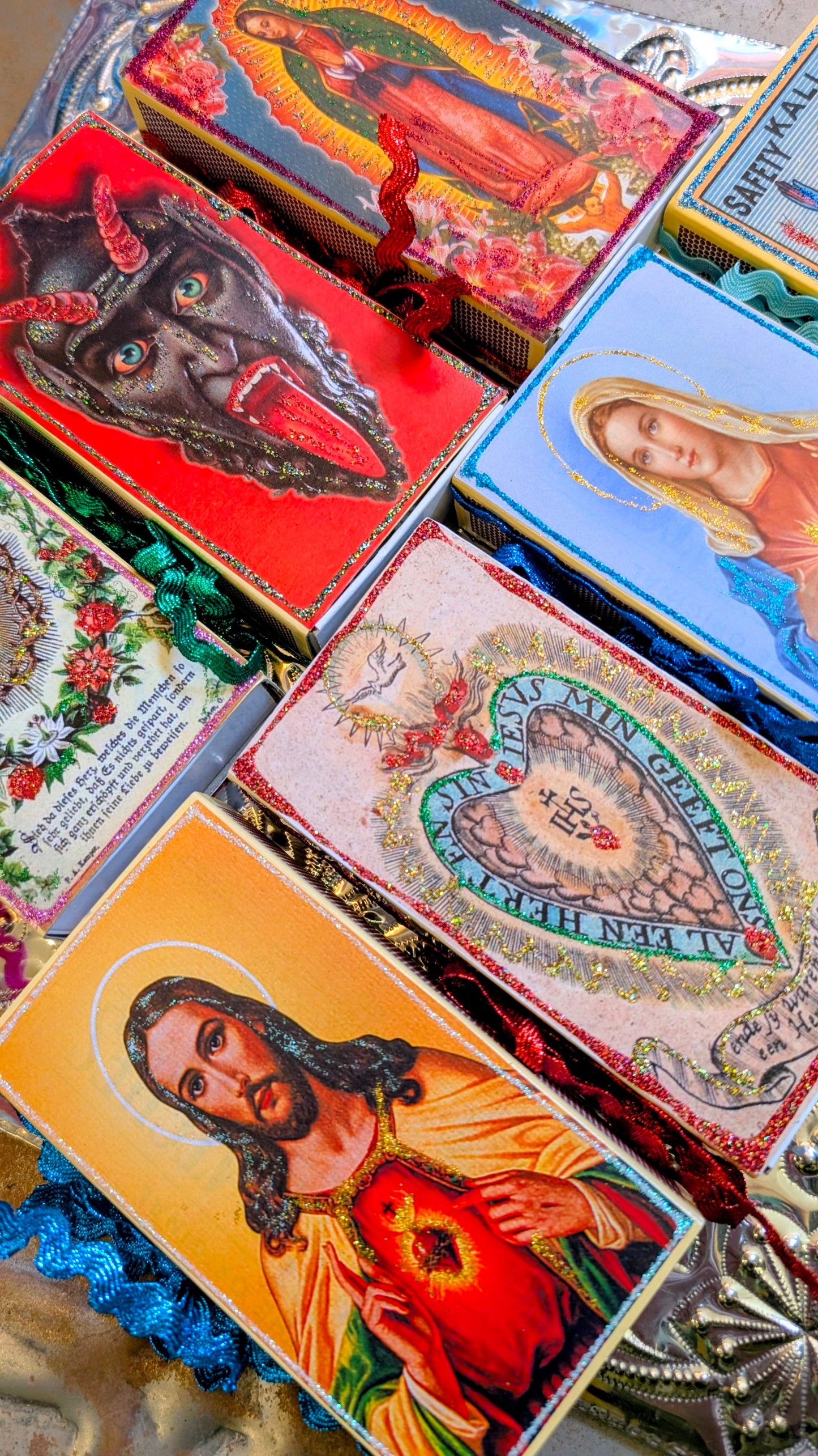Strike a light!!
Hand decorated religious and demonic themed matchboxes. Super cute gift and also great as a gift box!
Standard cooks matchbox size. 6.7 x 12cm.
Please be aware that shipping to some countries is prohibited.