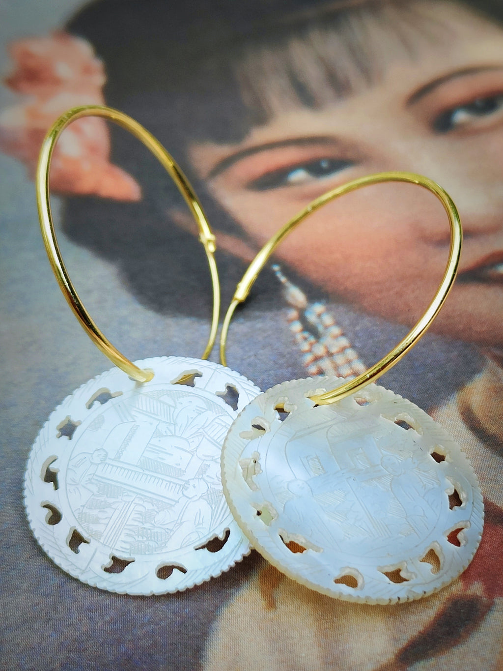 Gorgeous hoop earrings with antique, Chinese hand carved mother of pearl gaming counters hanging from them.

Counters are 2.5cm diameter 

Silver hoops 3.5cm diameter

Gold plated silver hoops 3cm diameter 



