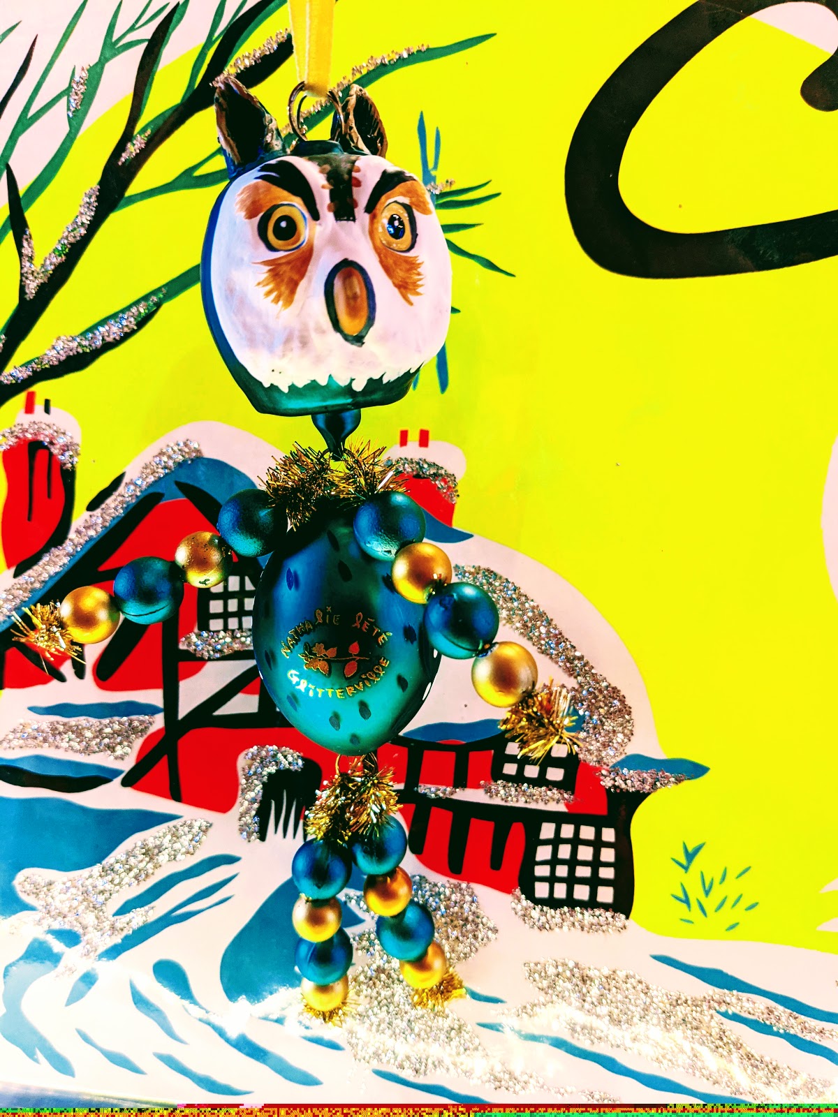 Handcrafted Christmas Owl Decoration by Nathalie Lété. This fantastic hand blown glass Owl ornament is the perfect addition for your Christmas tree or festive holiday display. Hand blown/painted glass decoration with ribbon Size 17 x 8 cm Fragile, handle with care
