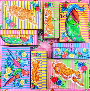 Handpainted in Pakistan by the artisans that paint the fabulously flamboyant trucks! These beautiful boxes are painted with heavy duty enamel paints onto steel cases.Use for jewellery, sewing, knitting, or even just to hide all the paperwork or gubbins you just don't want to see!! Suitable for light cool water washing only. Due to their handmade production, designs may vary and also have imperfections.

Sold individually. 

Dimensions large size are 30cm x 20cm x 13cm

Dimensions small size are 25cm x 16.5c