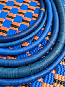 Statement stunning subtle shades of blue and indigo in these vintage necklaces made by hand of hundreds of discs die- cut from any plastic, bakelite,vinyl and vulcanite that could be found!

All unique and gorgeous,made in the 1970s.



