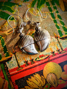 Earrings crafted by us from old silver  pendants was originally made and worn by the nomads of Rajasthan in Northern India.  It is in the shape of a mango, and is worn as a good luck and protection amulet. 

These move beautifully as all the bells are individually hung. 

Approx 4cm length.

Antique silver, there is no hallmark as these are old country pieces, but are a high grade silver. It

