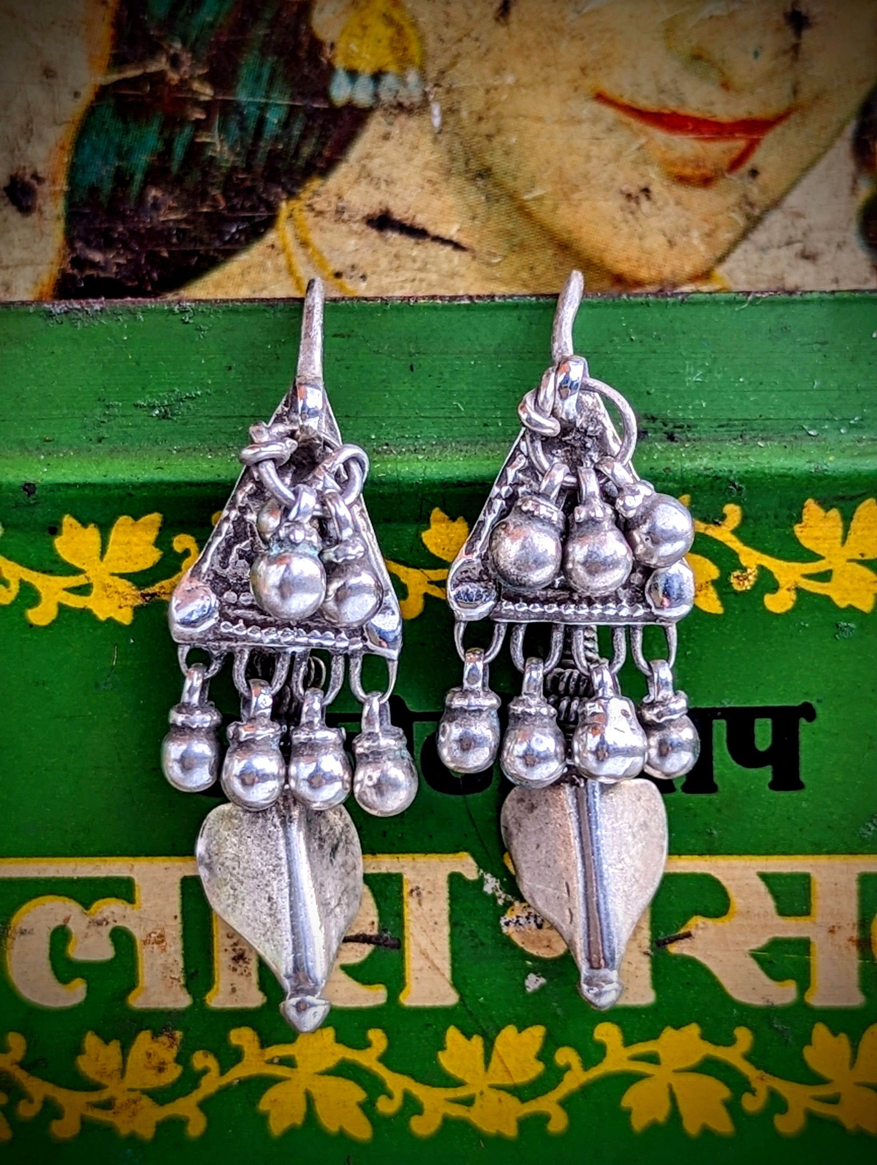 Lovely worn rare Rajasthani  antique silver earrings, these are a traditional Banjara design.

These move beautifully as all the bells are individually hung. These are completely original, and so have slightly thicker ear wires than the usual ones.

Approx 4cm length.

Antique silver, there is no hallmark as these are old country pieces, but are a high grade silver.