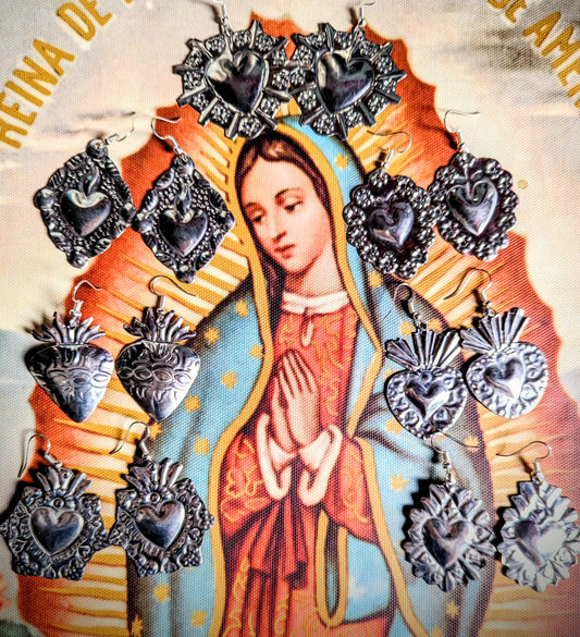Handmade tin earrings made in Mexico. Hooks are silver plated. 
5cm drop on average, some are 5cm wide if the orientation of the design is landscape. All pieces vary slightly as they are handmade
 Oaxaca
Sacred heart earrings
Sacred hearts

