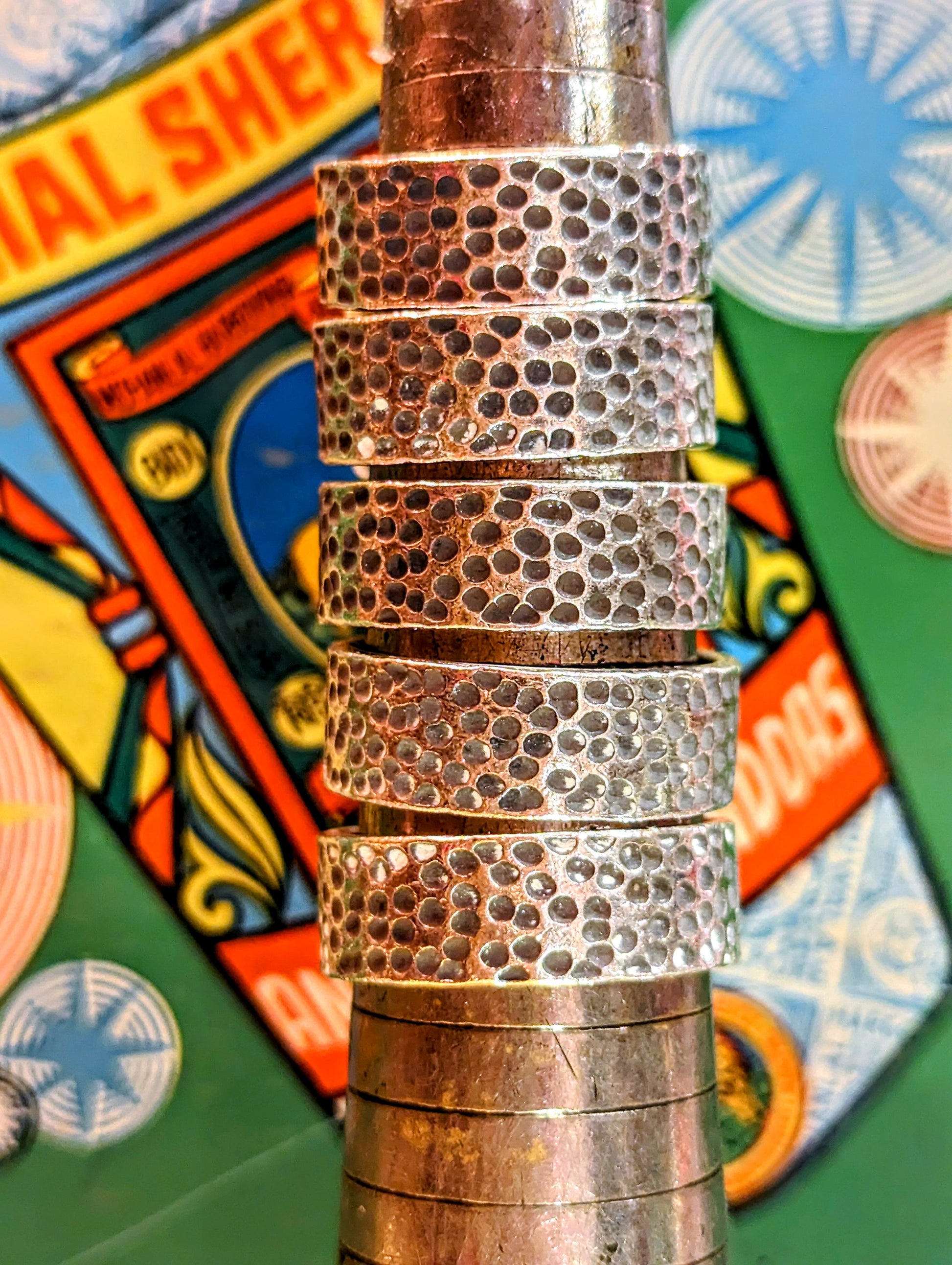 Karen hill tribe silver has a higher content of silver, at 99.5-99.9% compared with sterling silver at 92.5%. This allows the silver to wear and soften differently from standard sterling silver. Many of the Karen ring designs stack together beautifully. All pieces are hand made and hand finished using traditional methods.

Textured, hammered band, adding a little interest to a classic design and shows the malleable nature of this almost pure silver.

Width approx 1cm.