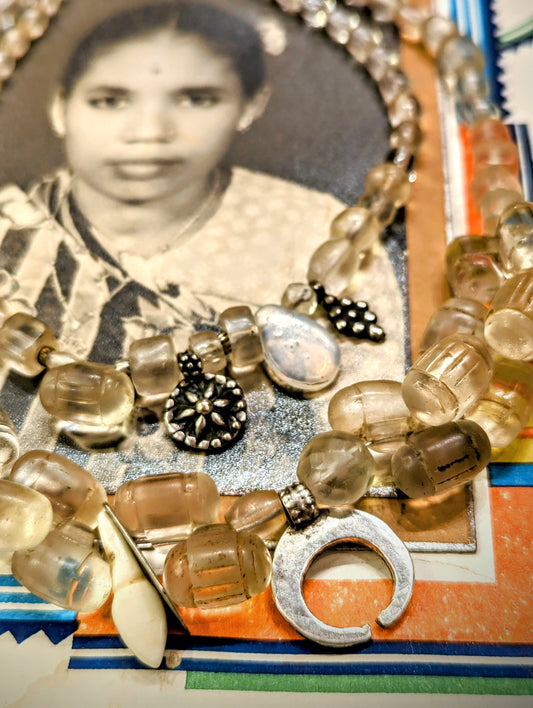 Bohemian glass beads made between the late 1800s and the early 1900s featuring Holari barrel shaped Fulani amulets and antique Saharan and Indian silver amulets and beads too.

The patina on the beads is beautiful, they are slightly frosted by generations of wear like sea glass !

Both necklaces are 49cm long, and have S hook clasps.

 