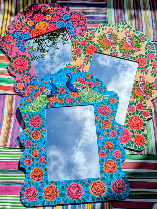 Big, beautiful birds and roses mirror