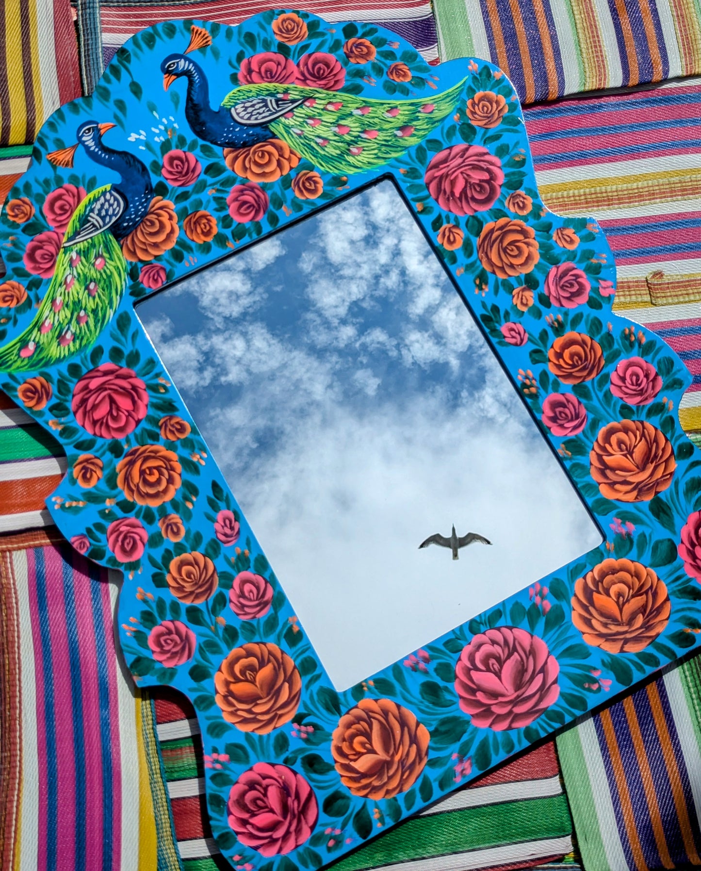 Big, beautiful birds and roses mirror