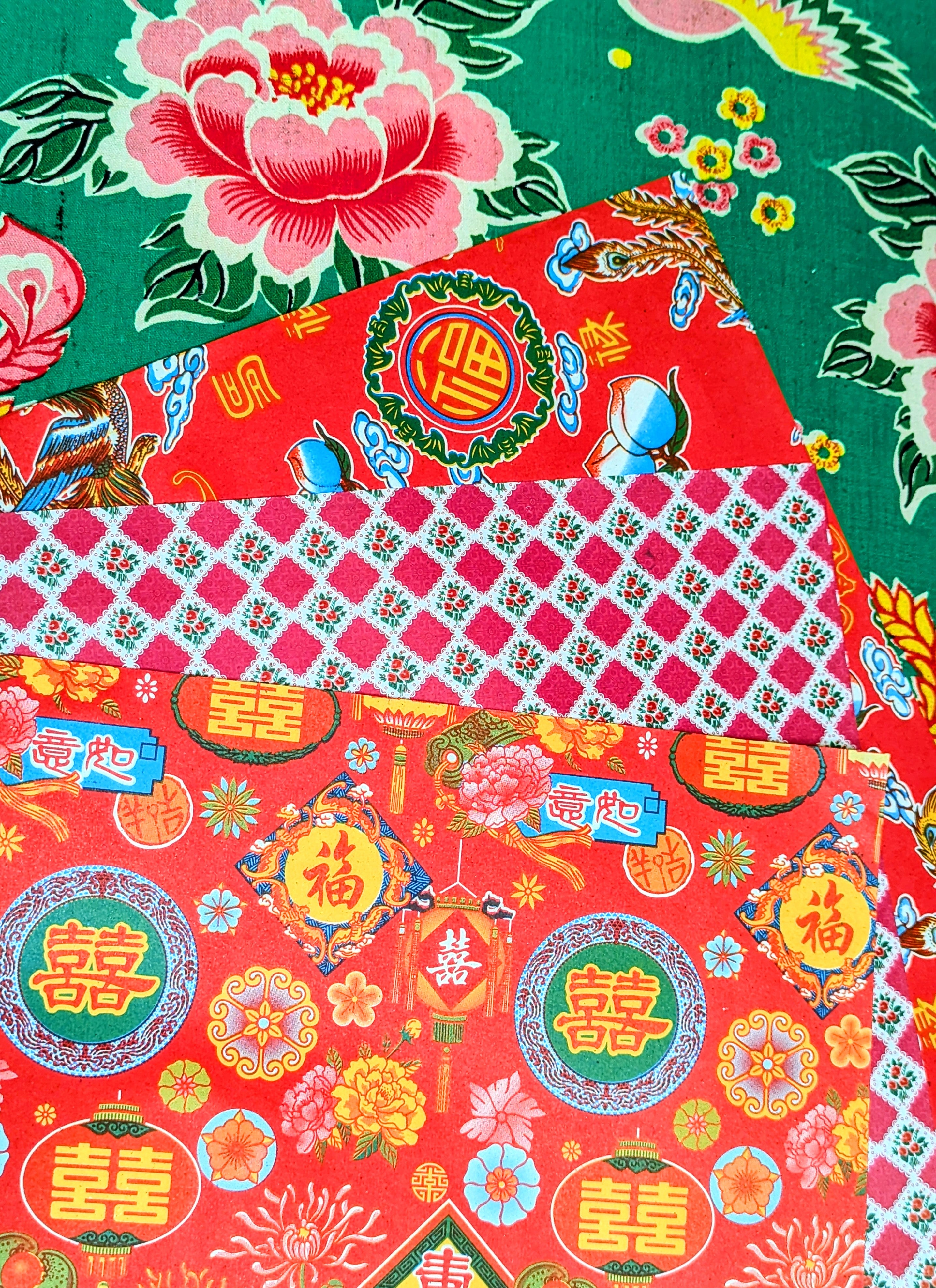 Gorgeous, super kitsch traditional Chinese festival papers, with lucky peaches and bats, strong dragons and light giving lanterns! Lightweight, great for wrapping presents, collage, scrapbooking, lining drawers, wallpapering dollhouses and paper mache.
These are used in traditional Chinese paper mache work to cover boxes, lampshades and containers, and the same designs have been made since the 1930s.
44x38.5cm approx , 3 sheets same design.
Lightly folded.
