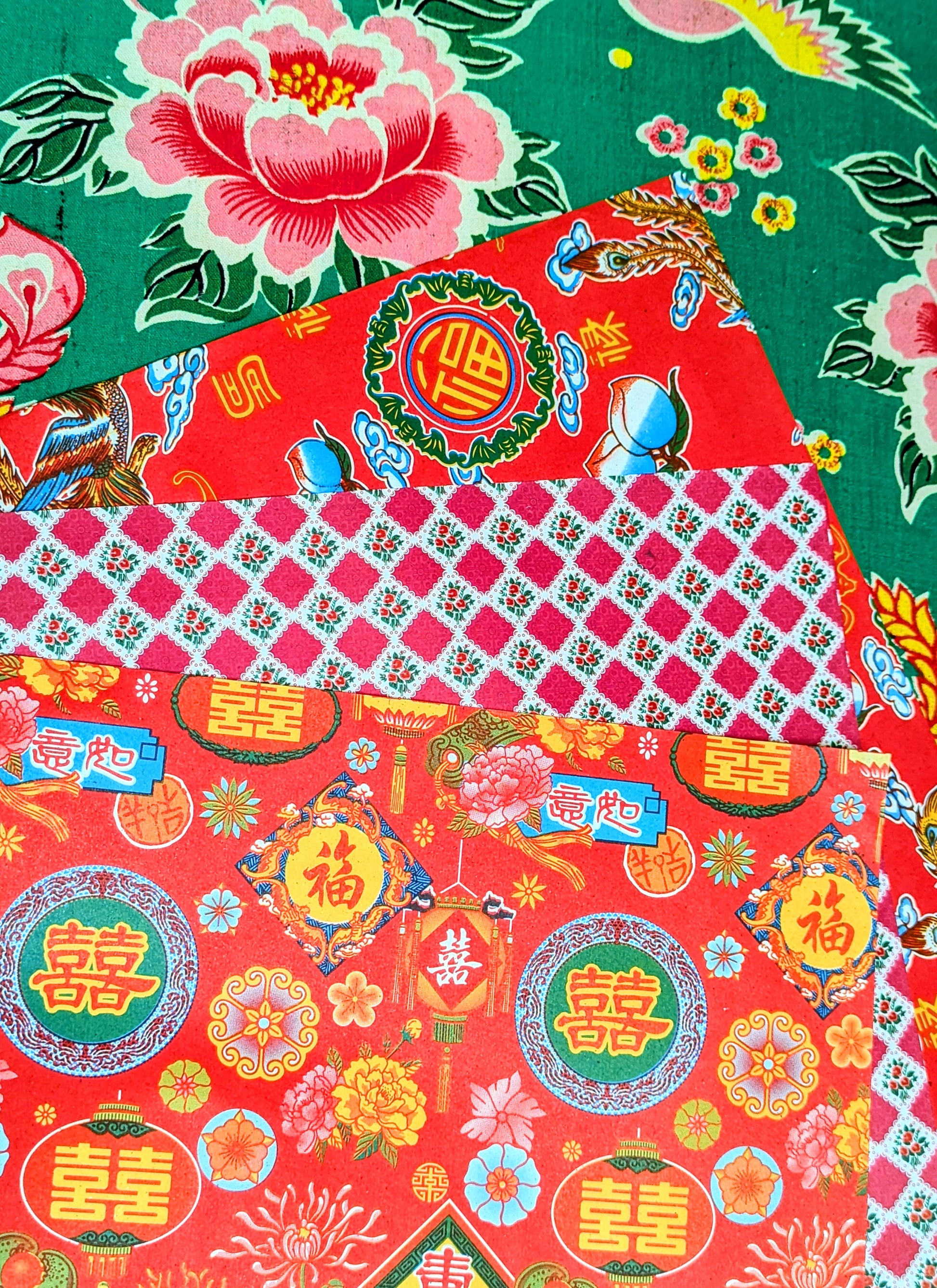 Gorgeous, super kitsch traditional Chinese festival papers, with lucky peaches and bats, strong dragons and light giving lanterns! Lightweight, great for wrapping presents, collage, scrapbooking, lining drawers, wallpapering dollhouses and paper mache.
These are used in traditional Chinese paper mache work to cover boxes, lampshades and containers, and the same designs have been made since the 1930s.
44x38.5cm approx , 3 sheets same design.
Lightly folded.
