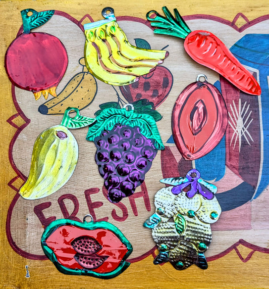 The word Milagros means Miracle. Traditionally milagros are given to saints to ask for a miracle and commonly nailed to the lintel of a door in the home. These milagros have been made by the artisans in Oaxaca to depict all the flora and fauna of Mexico.
Handmade and handpainted tin - all pieces vary in size, and colour. 
Approx 12 cm tall on average

 