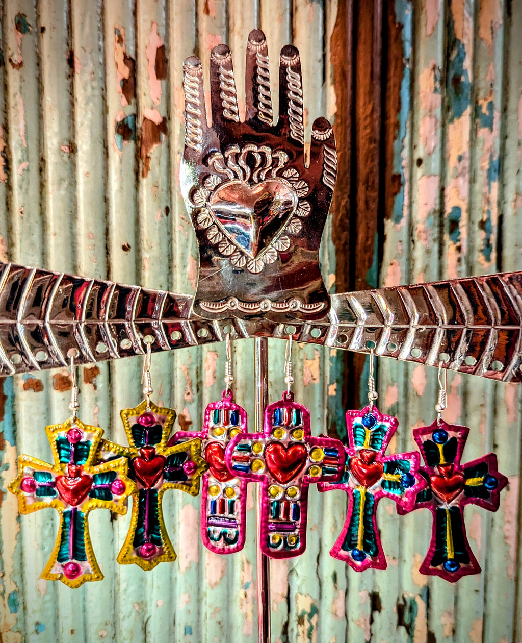 Colourful truly mexican cross handmade tin (poor man's silver!) earrings made in Oaxaca, Mexico.

Tin cross
Silver plated nickel hooks
Approx 5cm drop