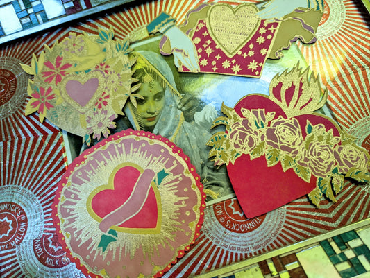 Inspired by our love of Mexican folk art, these cards have gilded gold details and a beautiful decorated envelope. Die cut in the shape of a flaming heart, with a panel on the reverse for your message.

 

-  Screen printed recycled cotton C5 greetings card
-  Screen printed by hand on both sides by  talented artisans in Jaipur
- Sustainably made from recycled materials
- Protected with a bio degradable cello sleeve
East End Press
Valentine card
