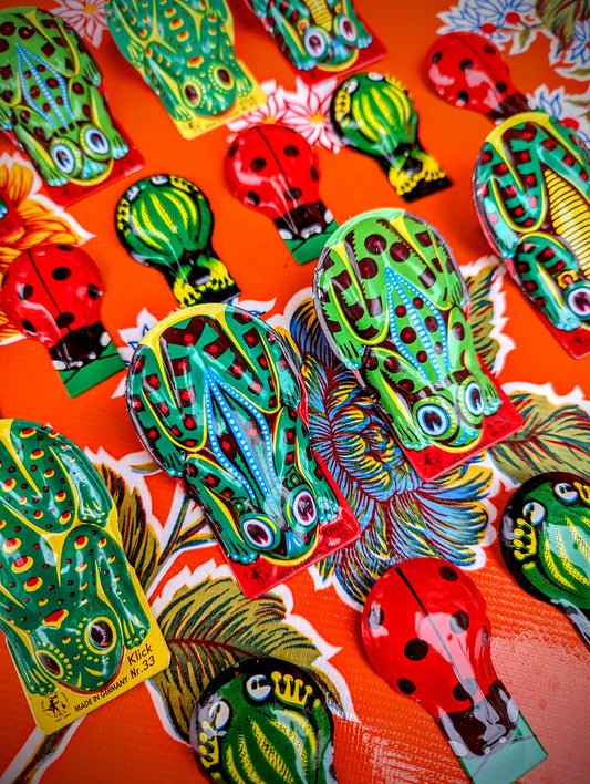 Gorgeous vintage Czech and East German designs still made today!! Printed tin click clacks, a fun noise maker, and great for training dogs too!

Not suitable for children 

Small Czech ladybirds
Vintage east Germany tin toysand frogs
 approx 6cm x 4cm
Clock clack

Larger DDR frogs approx 8 x 5cm



