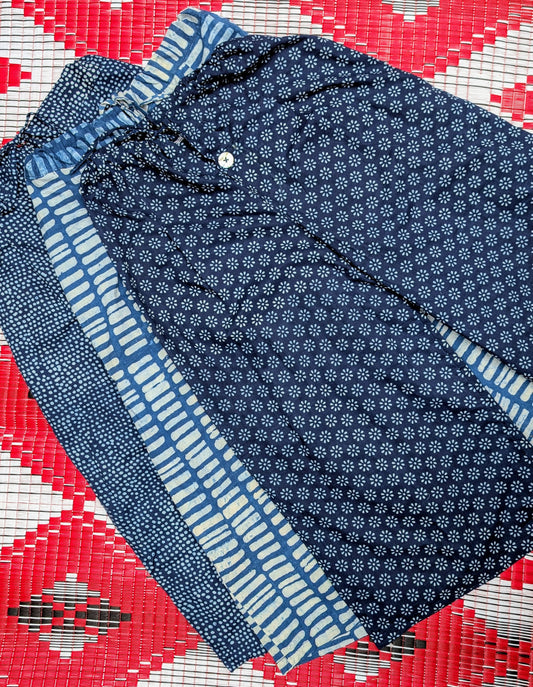 Gorgeous soft fine cotton , hand resist-dyed in  natural indigo using block prints, the fabric is handmade in India, then it is taken and.made in Thailand working with the same family of seamstresses for 25 years. Patterns and sampling made here in the UK by our founder Anna Moody.

One Size (10-14) 

Button fly

Waist when untied- 17 inches

Length - 35 inches 

 