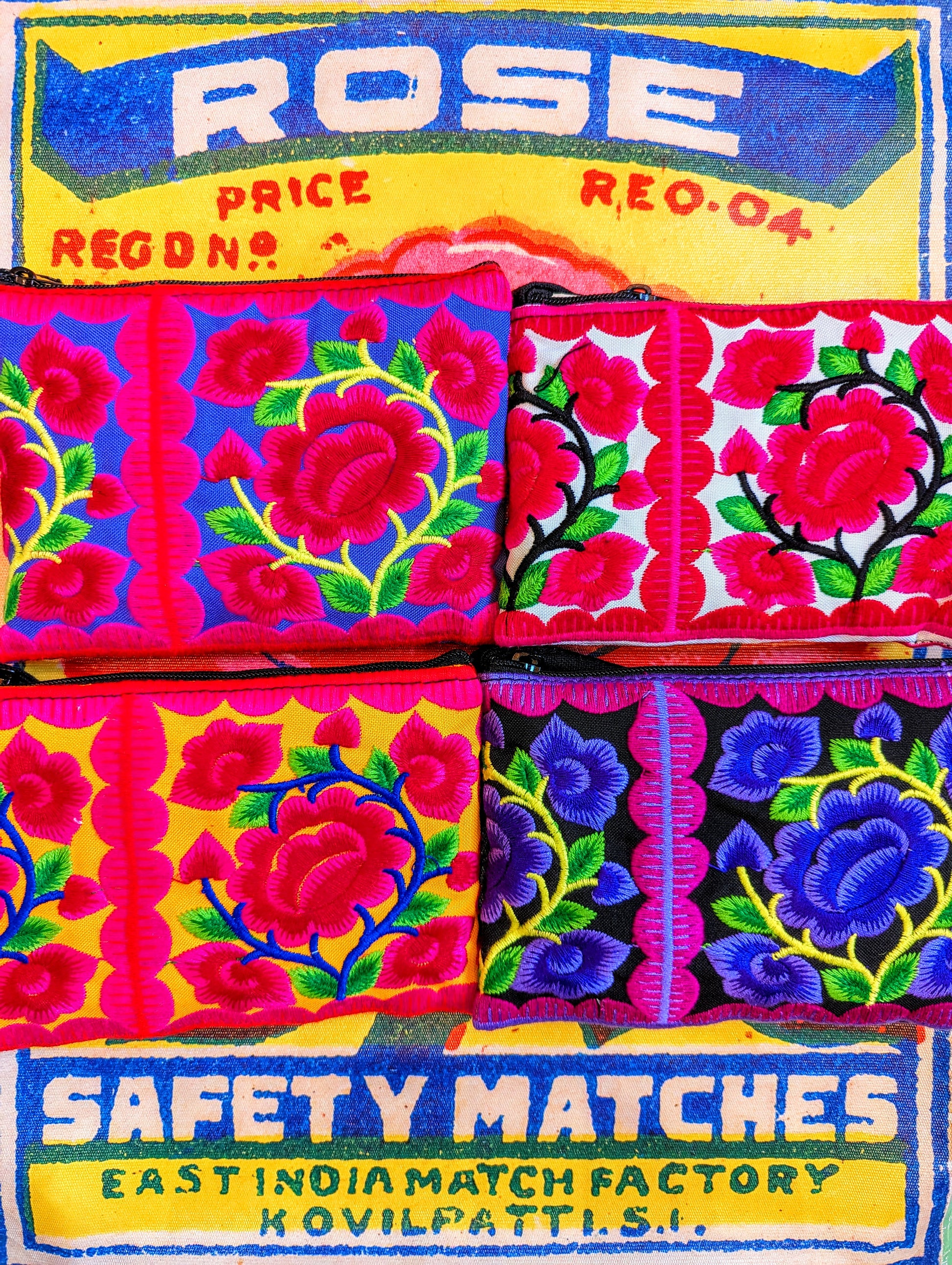 Fancy and super bright gorgeous floral embroidered cotton purses made from patches traditionally embroidered for Vietnamese and Chinese Hill tribe baby carriers.

14cm x 10cm

