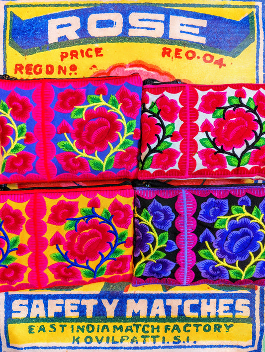 Fancy and super bright gorgeous floral embroidered cotton purses made from patches traditionally embroidered for Vietnamese and Chinese Hill tribe baby carriers.

14cm x 10cm

