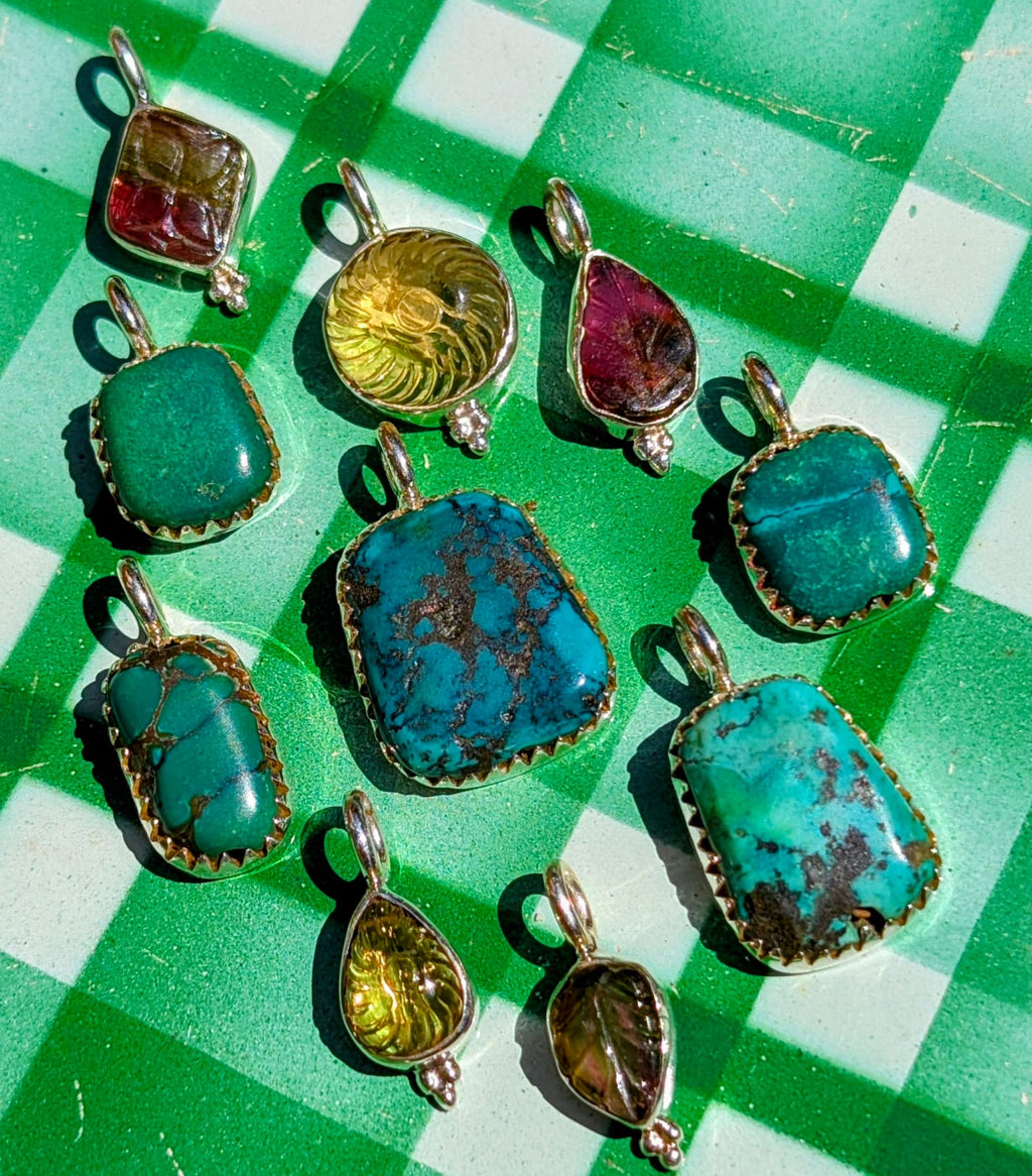 
A gorgeous selection of hand carved stones, and antique Tibetan turquoise we collected in Jaipur, Rajasthan, all set in fancy silver bezel or bobbles to make loveliest pendants, something for everyone!!

1 tourmaline, 21 x 13mm
2 turquoise, 18 x 10mm
3 citrine, 22 x 10mm
4 tourmaline, 21 x 10mm
5 turquoise, 22 x 10mm
6 turquoise, 28 x 17mm
7 turquoise, 22 x 10mm
8 citrine,  19 x 7mm
9 turquoise, 28 x 12mm
10 tourmaline, 20 x 6mm
Sizes include pendant loop.




