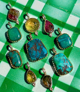 
A gorgeous selection of hand carved stones, and antique Tibetan turquoise we collected in Jaipur, Rajasthan, all set in fancy silver bezel or bobbles to make loveliest pendants, something for everyone!!

1 tourmaline, 21 x 13mm
2 turquoise, 18 x 10mm
3 citrine, 22 x 10mm
4 tourmaline, 21 x 10mm
5 turquoise, 22 x 10mm
6 turquoise, 28 x 17mm
7 turquoise, 22 x 10mm
8 citrine,  19 x 7mm
9 turquoise, 28 x 12mm
10 tourmaline, 20 x 6mm
Sizes include pendant loop.




