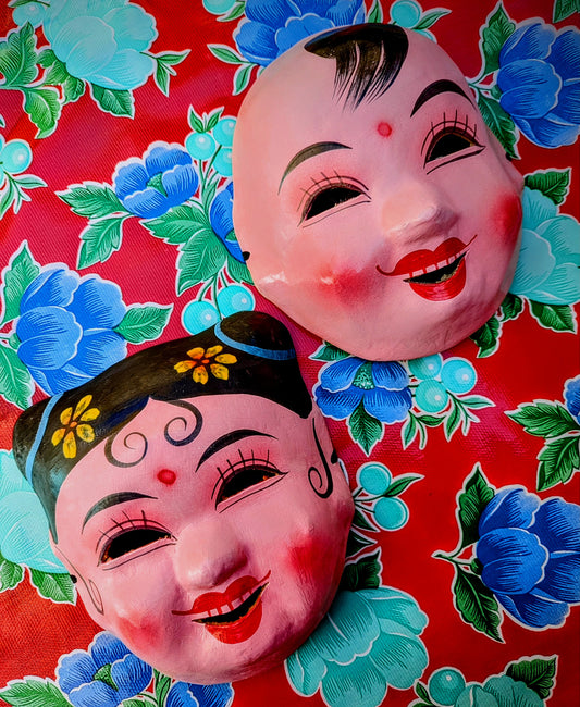 Made by hand from paper mache in Guangzou, China, the home of a fascinating street of Chinese opera costumes, these girl and boy masks are used in plays and festivals, and are the absolute cutest!!

Approx 23 x 26.x 7cm
Chinese opera masks