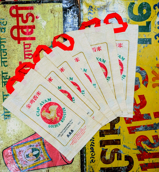 Recycled rice bags with fabulous golden rooster brand design, fabulous for gift bags or for a bit of shopping!!....also looks great along with our punchy packaging clothing!.

Made with recycled woven plastic.

Approx 44 cm x 23cm x 7cm plus handles.

 