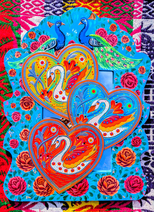 Stunning, sturdy metal love hearts, hand punched and decorated with true loving swans, depicted in razor cut vinyl by the truck artists of Pakistan

These traditionally are used to decorate the trucks outside or in, and are really beautifully made.

30 x 30cm

Chromed steel, vinyl sticker, fabric backed.

 

 