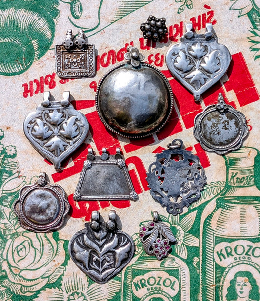 Antique silver floral pendants