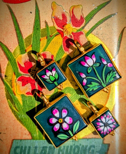 
A truly gorgeous selection of green onyx stones, hand enamelled with glorious mughal style miniature flowers that we collected in Jaipur, Rajasthan, all set in fancy silver bezel or bobbles, and gold plated in pure , butter-yellow Indian gold to make loveliest pendants.

Sizes include pendant loop.
Small 2.4cm x 1.3cm
Large 3.2cm x 2.2cm

Remove when washing and keep away from perfume and creams to preserve plating.




