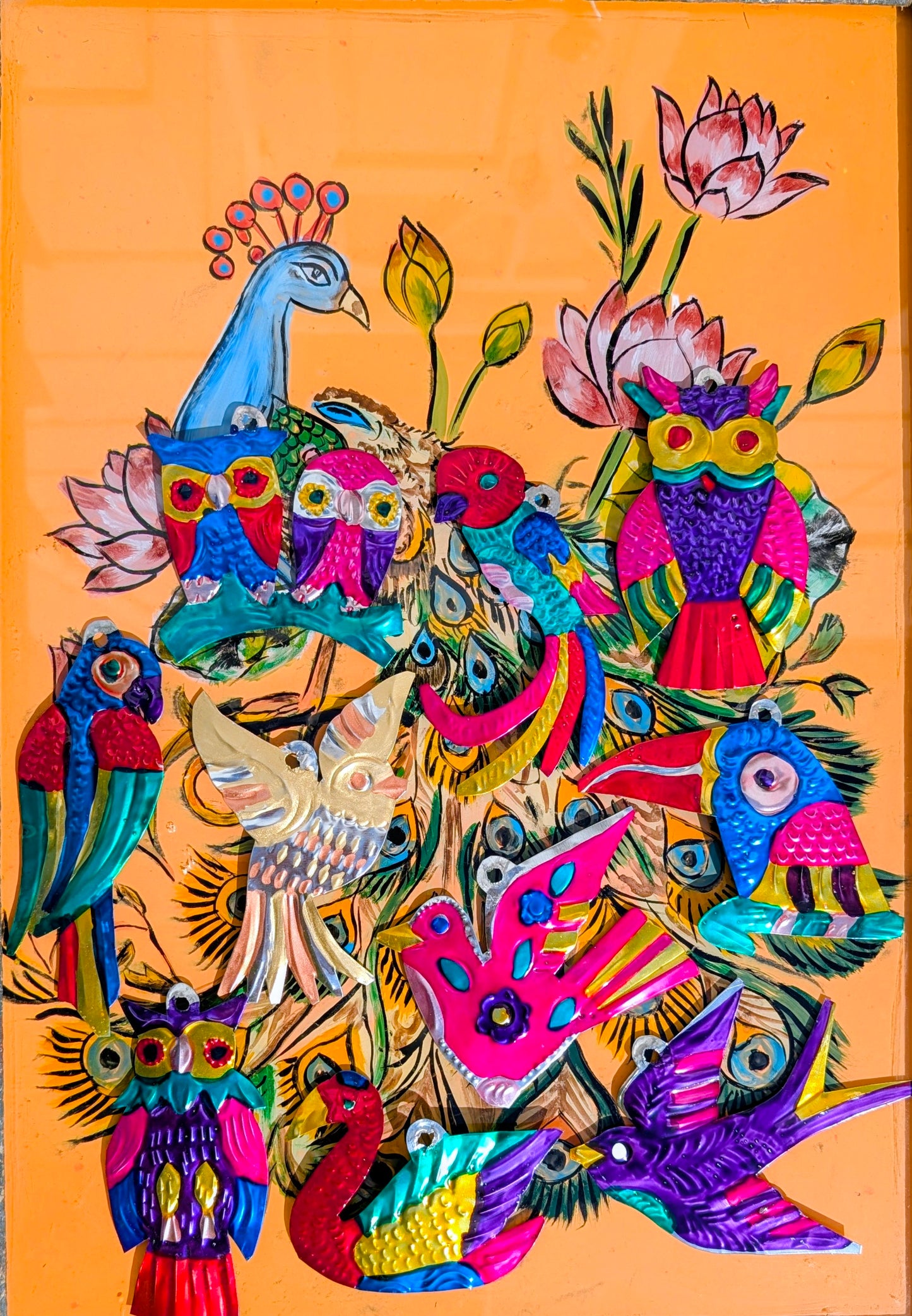 Beautiful, bright tin birds. Traditionally milagros are given to saints to ask for a miracle and commonly nailed to the lintel of a door in the home. These milagros have been made by the artisans in Oaxaca to depict all the flora and fauna of Mexico.
Handmade and handpainted tin - all pieces vary in size, and colour. 
Approx 12 cm tall on average

 
