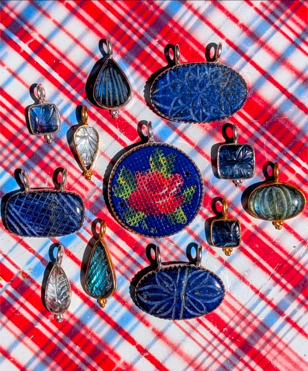 A gorgeous selection of hand carved stones we collected in Jaipur, Rajasthan, and a fabulous vintage glass, hand painted French rosey brooch finding, all set in fancy silver bezel or bobbles to make loveliest pendants, some we had gold plated, and some we left silver, something for everyone!

1 kyanite, 10 x 20mm silver
2 aquamarine,  24 x 8mm gold plated
3 labradorite, 20 x 20mm, gold plated 
4 painted glass, 30 x 37mm, silver.
5 lapis lazuli, 32 x 27mm, silver
6 kyanite, 12 x 20mm, silver.
7 lapis lazuli,