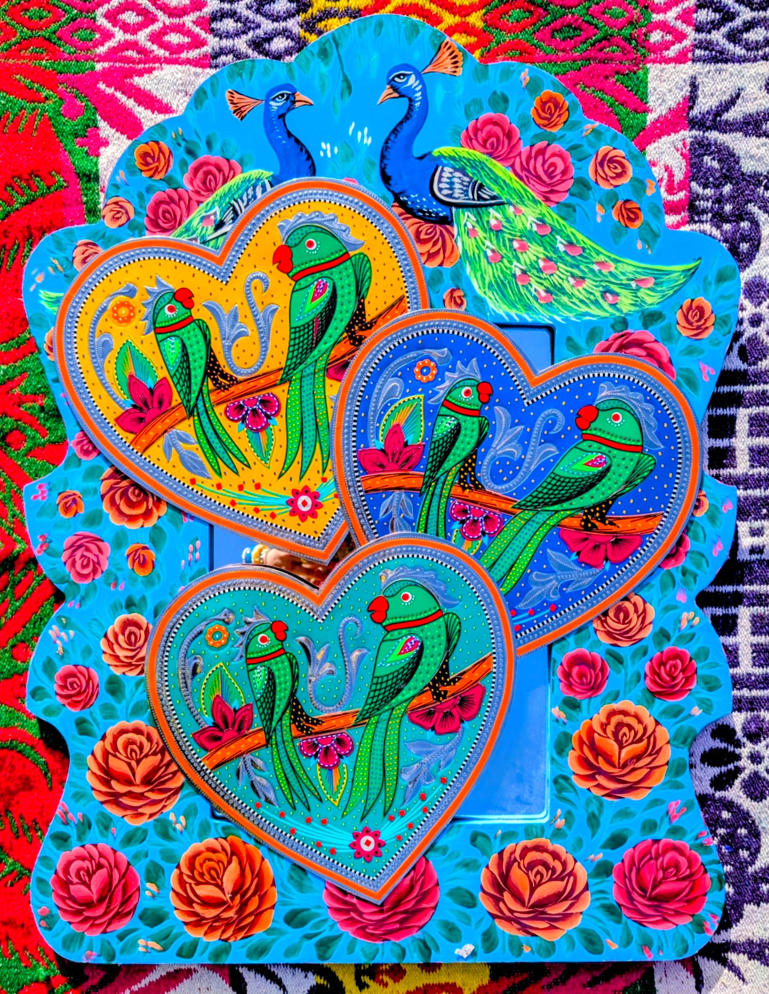 Stunning, sturdy metal love hearts, hand punched and decorated with true loving parakeets depicted in razor cut vinyl by the truck artists of Pakistan

These traditionally are used to decorate the trucks outside or in, and are really beautifully made.

30 x 30cm

Chromed steel, vinyl sticker, fabric backed.

 

 