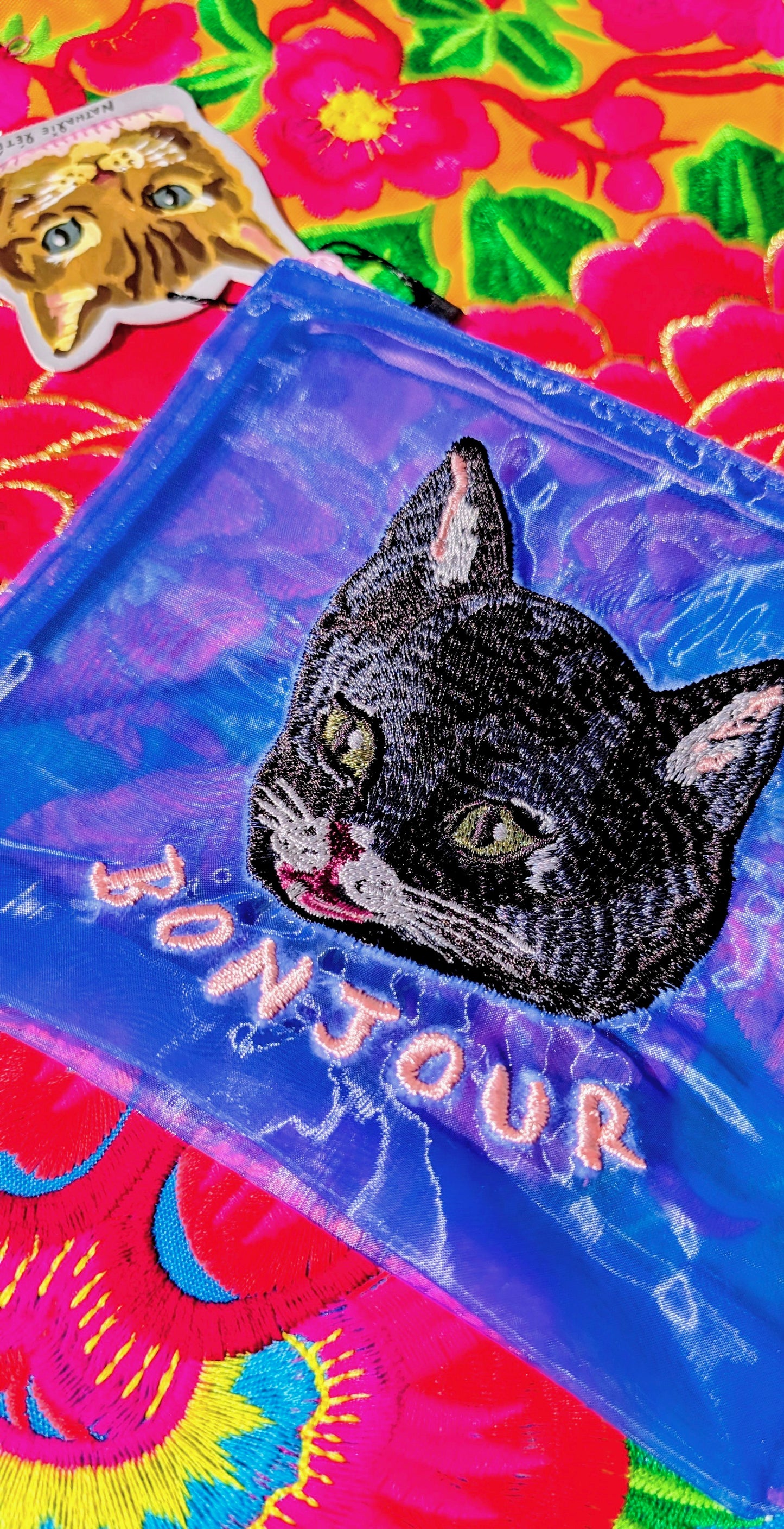 Embroidered puss pouch