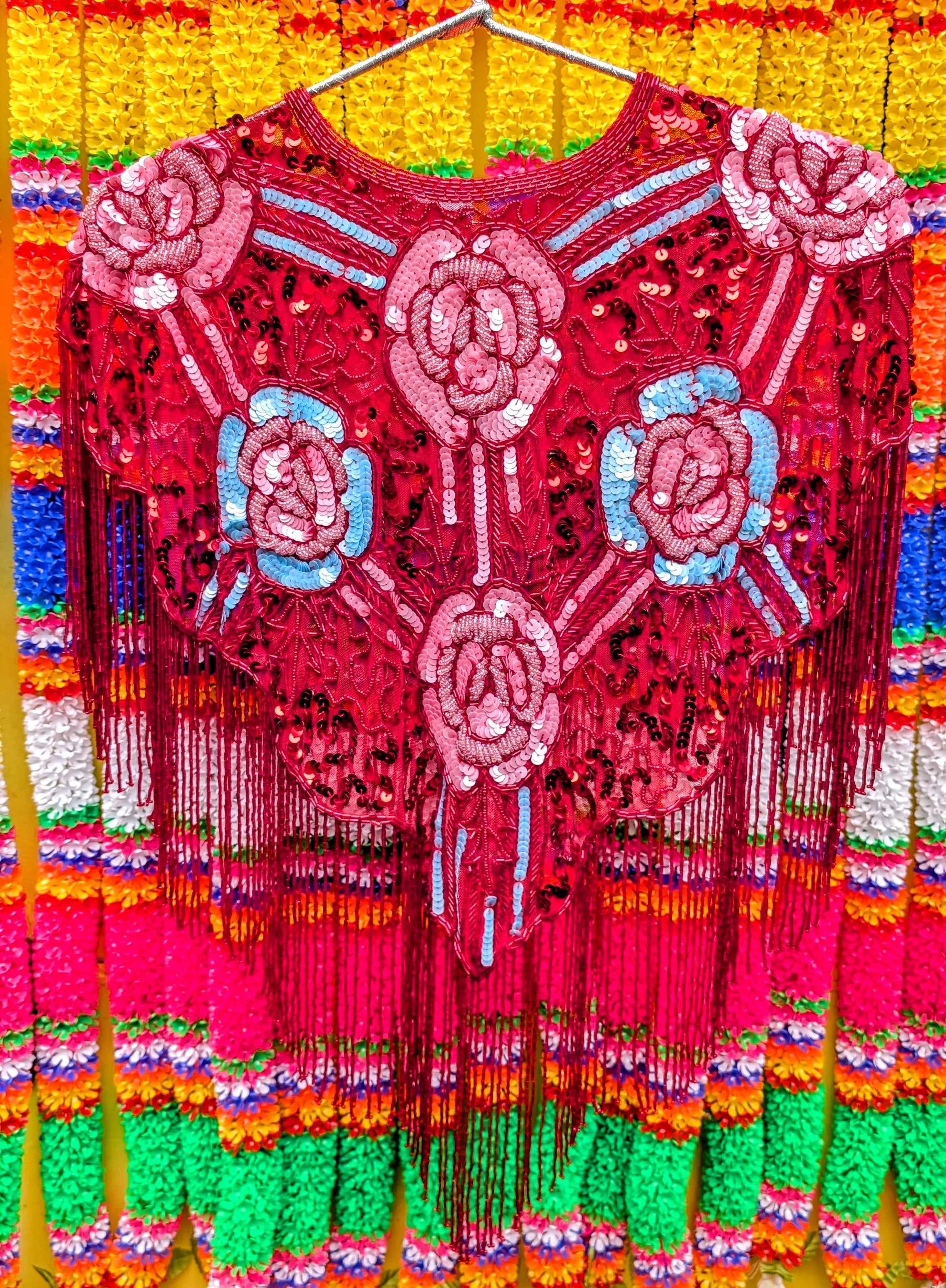 Folky florals in neon pastel brights for maximum fun and colour!!!.....this sequin cape will turn any....any ...outfit into a party outfit, sling it on over dresses, jumpsuits, T-shirts, whatever, and you will feel and look fabulous!!..then get on out to a party, festival or performance!!

One size fits all

All beads and sequins are securely sewn, pack away gently when not in use, and this will see many parties for years to come!!

 
