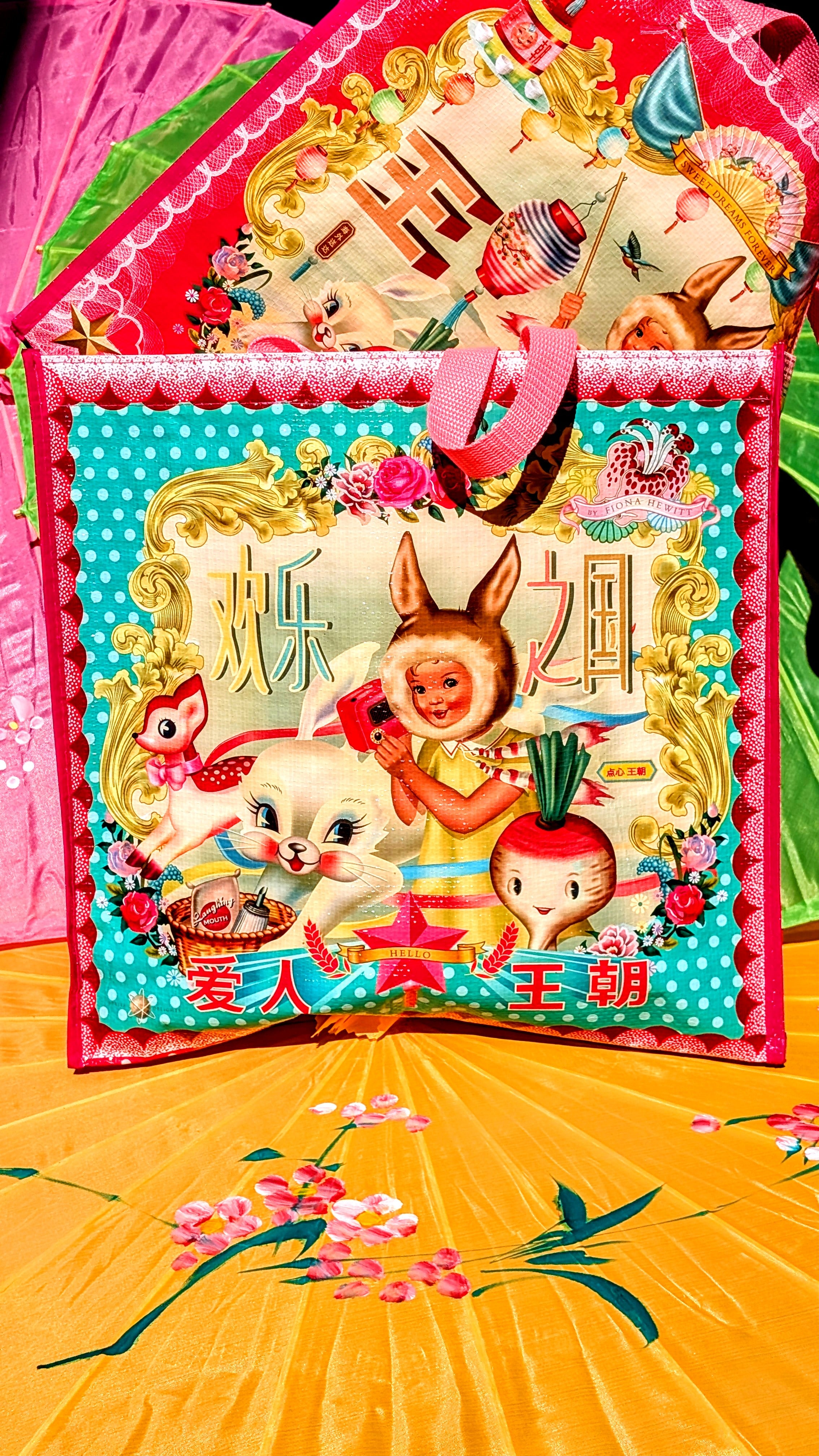 Bags of joy !!🌈 Printed canvas bag in the most vivid colours. Super kitsch to brighten up any trip to the green grocers!
The image appears on both sides of the bag, and with bunny gal one side is green and the other side is pink, whats not to like!!
 Size 40 x 38 X 15cm approx 
Wipeable
Fiona Hewitt
Dumpling dynasty 