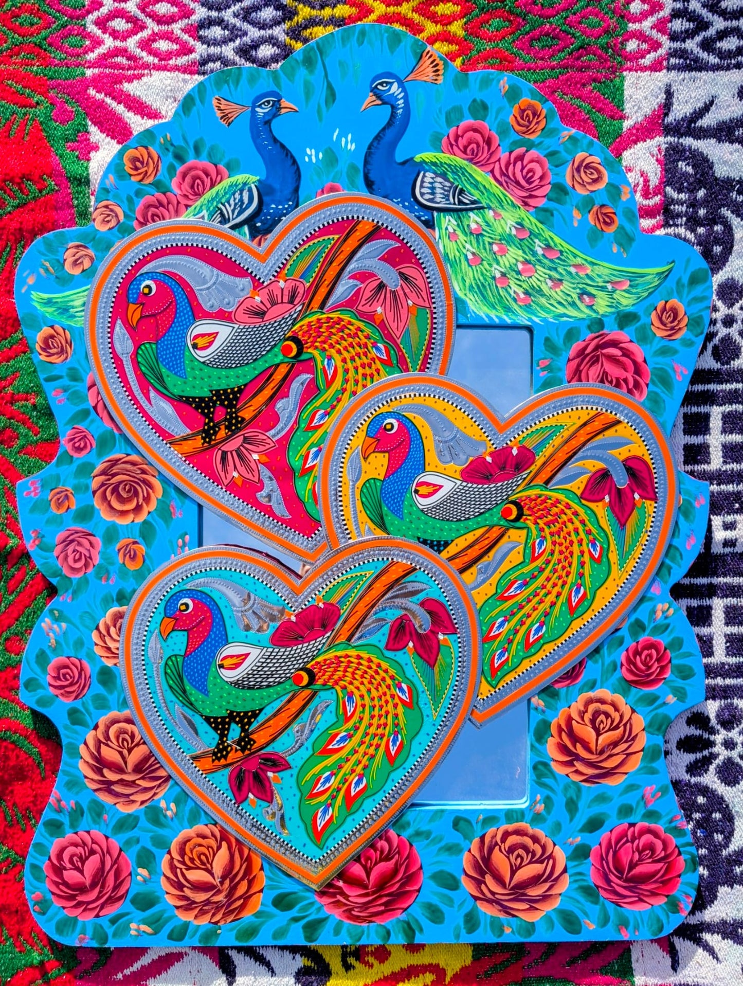 Stunning, sturdy metal love hearts, hand punched and decorated with just true loving pracocks depicted in razor cut vinyl by the truck artists of Pakistan

These traditionally are used to decorate the trucks outside or in, and are really beautifully made.

30 x 30cm

Chromed steel, vinyl sticker, fabric backed.

 

 