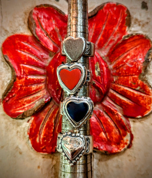 Vintage Rajasthani nomads rings, super hard to find, some with original glass stone, some silver hearts, the glass set ones are usually chipped out and replaced with a modern turquoise stone, so lovely to find old ones

High grade silver , some with set glass.

 Banjara
Heart ring
Antique silver heart ring
