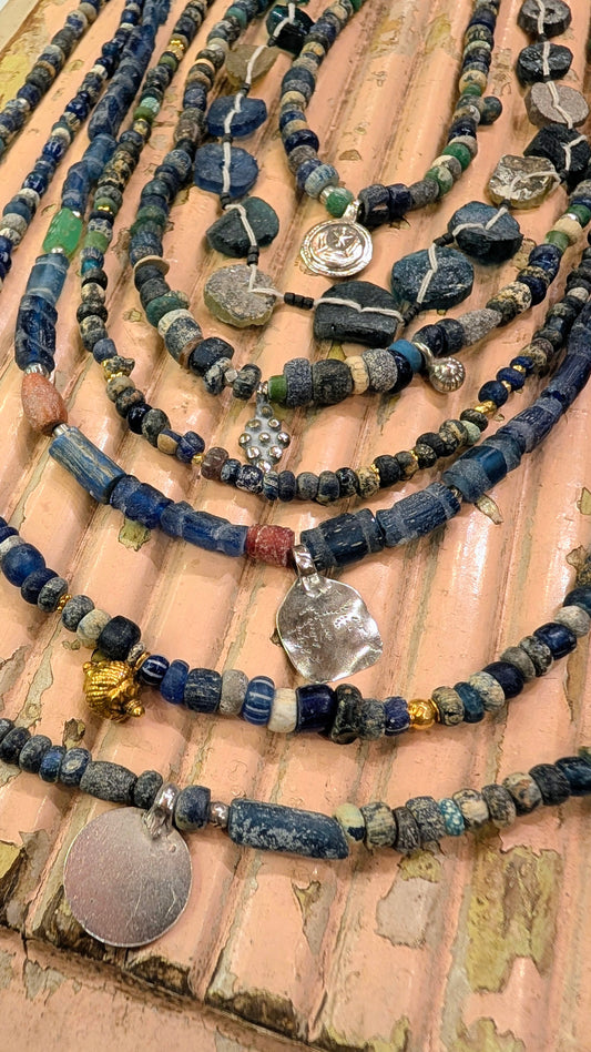 Antique excavated blue glass beads