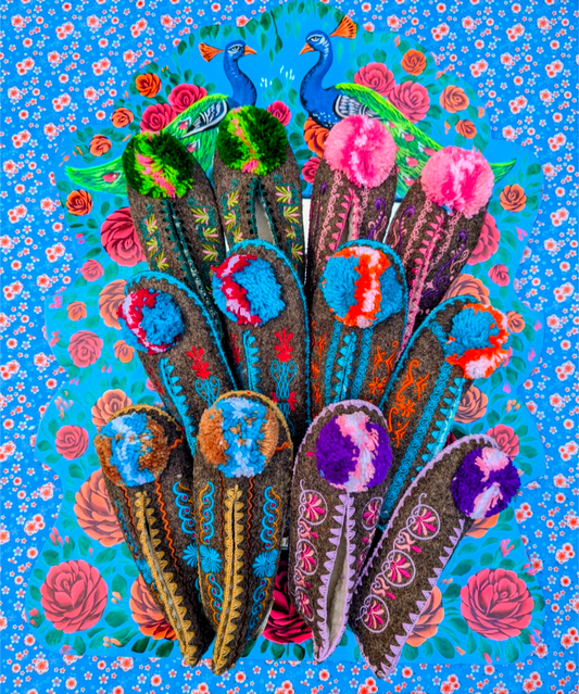 Handmade in Greece, years ago we would buy them directly from a lovely old lady who would even hand embroider them!!!! Sadly those days are no more, but these are just as fantastic, with the only difference being that they are now machine embroidered.

Super comfortable with a practical non-slip suede leather sole which is durable and waterproof yet still flexible and breathable. Made from sheep's wool and lined inside with soft man-made fur and cotton blend making them very comfortable both with or without
