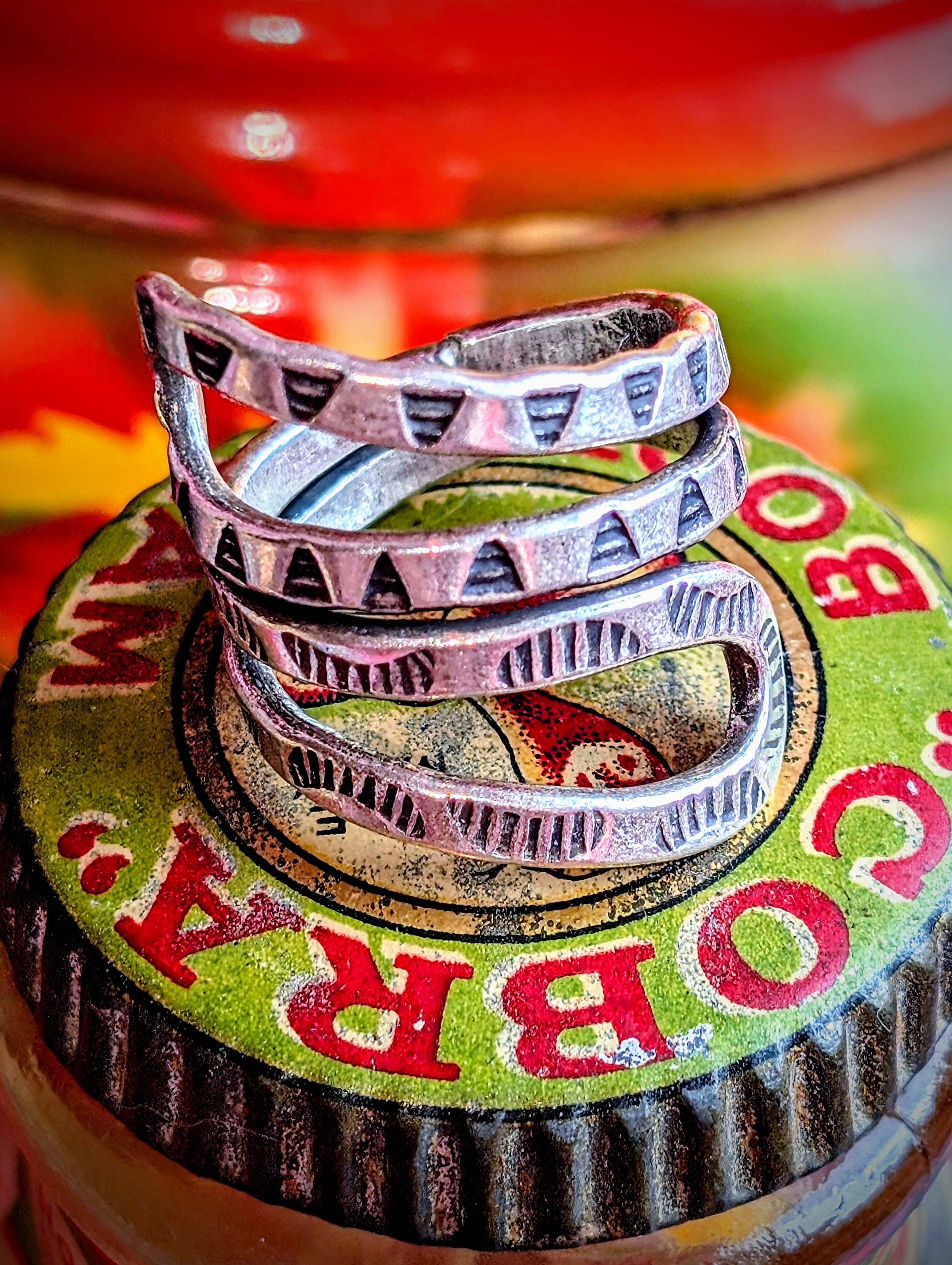 Snakey, sculptural, stamped rings. Available in sizes, but these are such soft silver they can be stretched or coiled in to fit. All pieces are hand made and hand finished using traditional methods.
Hill tribe silver has a higher content of silver, at 99.5-99.9% compared with sterling silver at 92.5%. This allows the silver to wear and soften differently from standard sterling silver. All pieces are hand made and hand finished using traditional methods. The texture in these pieces show the malleable nature 